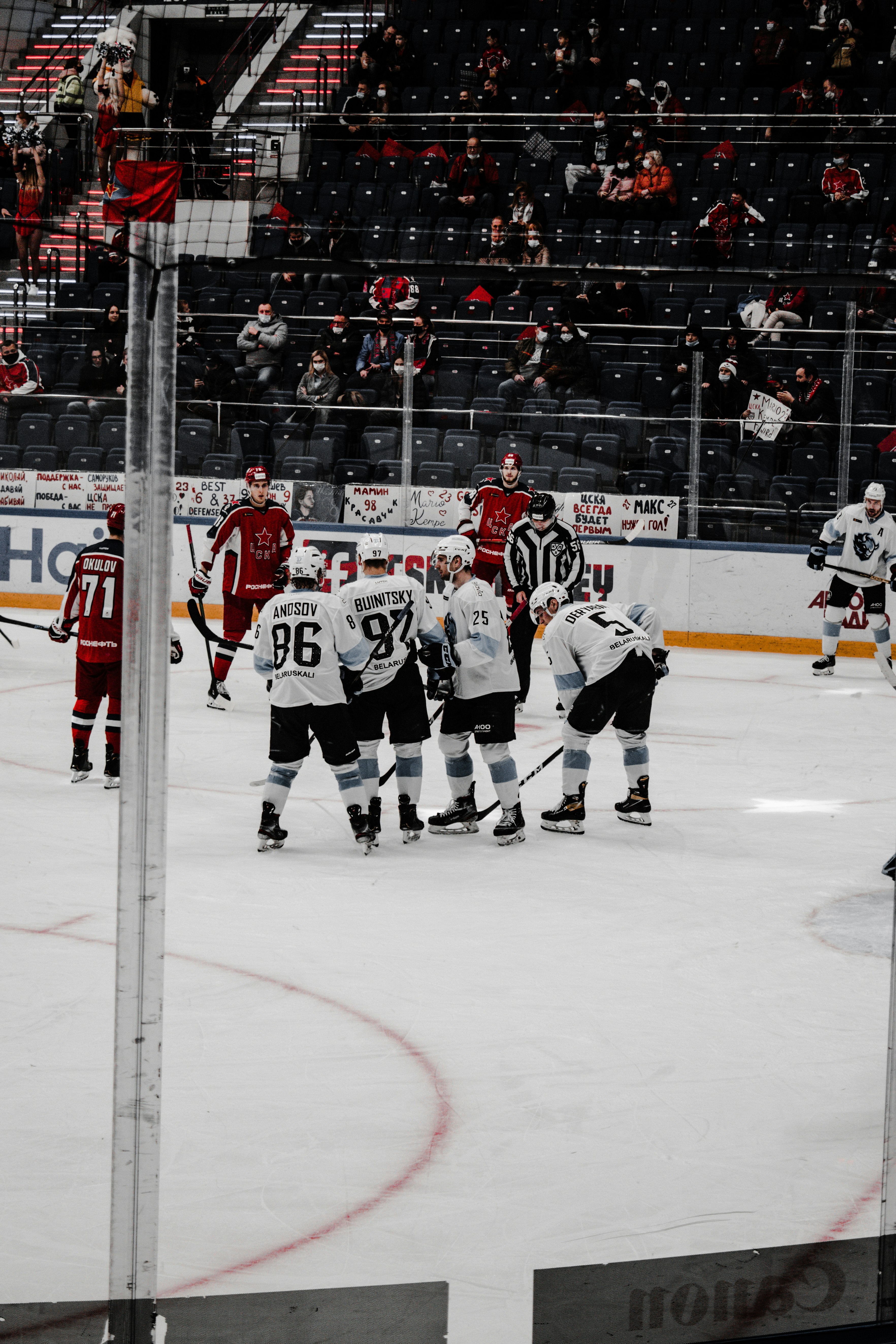 ice hockey players on ice hockey field